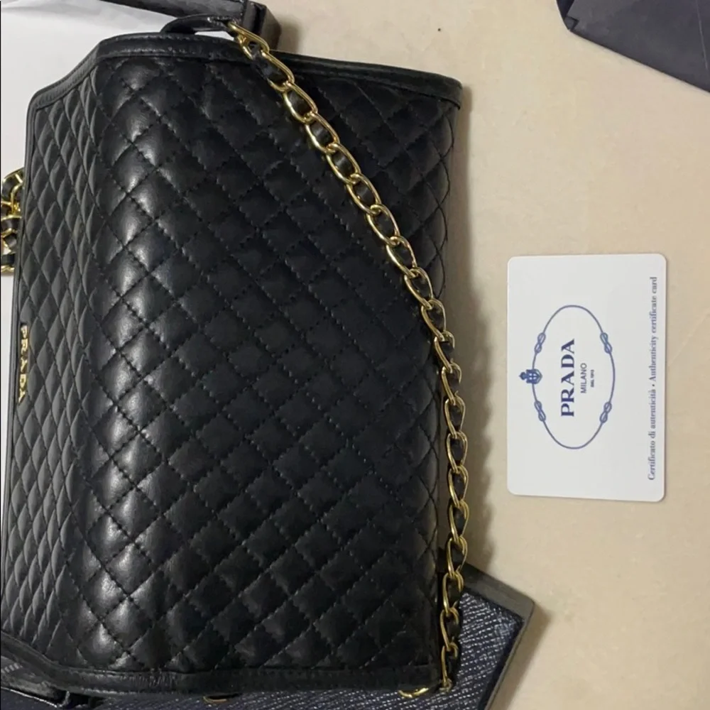 Prada quilted leather with gold chain wallet